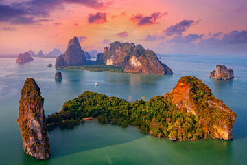 Sunset beautiful landscape of nature Thailand, Long tail boat with tourist on Hong tropical island and Phang Nga bay in turquoise sea, aerial view