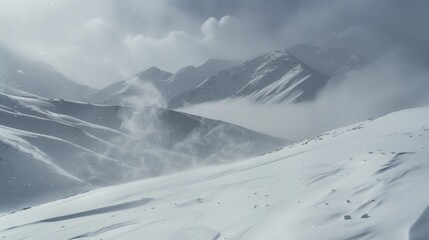 Snowy Mountain Peaks Under a Foggy Sky