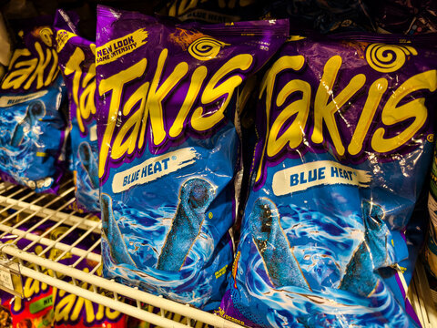 Takis Blue Heat spicy chips in supermarket aisle