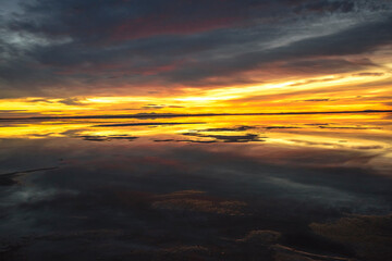 Sunrise over salt flat area