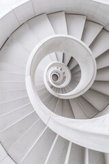 Fototapeta premium A majestically spiral staircase in a modern building. Close-up of a kinetic spiral staircase sculpture defying the laws of gravity and geometry.