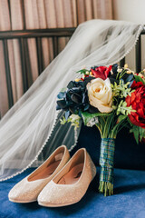 bridal shoes and bouquet