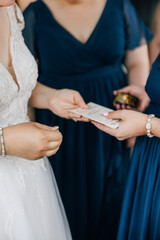 hands exchanging letter