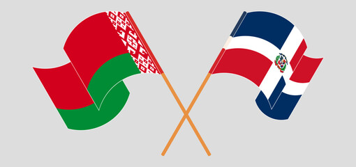 Crossed and waving flags of Belarus and Dominican Republic