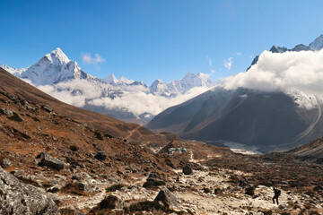 Walking up towards the Everest Memorial Chukpi Lhara, the Dughla village in front of Mount Amphu...
