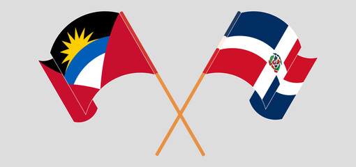 Crossed and waving flags of Antigua and Barbuda and Dominican Republic