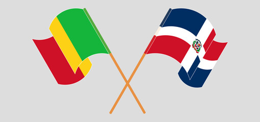 Crossed and waving flags of Mali and Dominican Republic