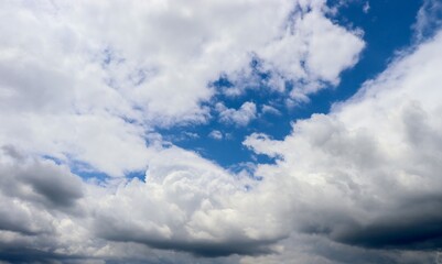 The white fluffy clouds in the blue sky.