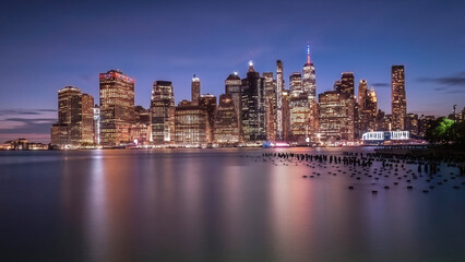 Obraz premium Skyline of Manhattan at sunset on a blue sky-July 2024