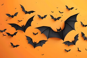 Fototapeta premium Decorative black bats flying on a vibrant orange background, perfect for Halloween themes.