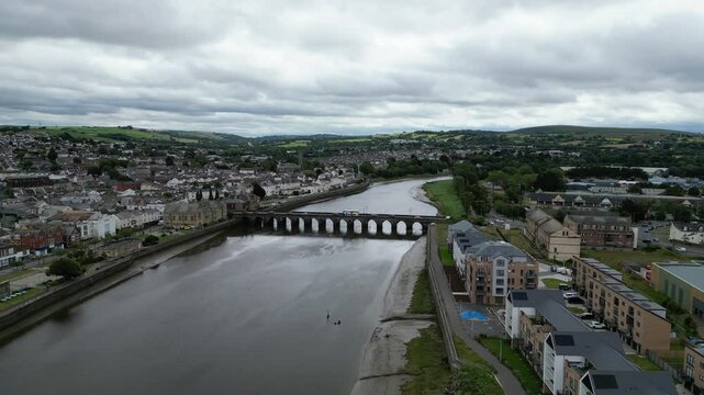 Barnstaple, Devon, England: DRONE VIEWS: Long Bridge spanning the River Taw in central Barnstaple. The medieval bridge reflects the town's early history as a prosperous wool trading centre (Clip 8).