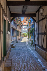 Passage and half-timbered houses in the Alley called Schuhhof (shoemakers court) in the old city of Quedlinburg, Saxony-Anhalt, Germany