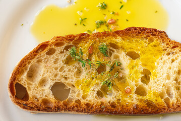 Bruschetta, Italian Tonscan bread with oregano and olive oil. Italian simple cuisine, iconic...