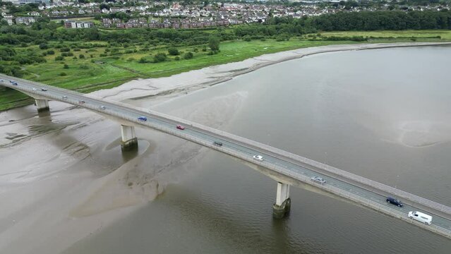 Barnstaple, Devon, England: DRONE VIEWS: The A361 bridge spanning the River Taw. The A361 bridge crosses the River Taw at the river's lowest point and is a major local transport artery (Clip 2).
