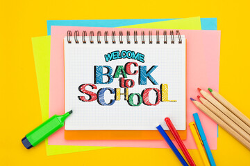 Back to school background. Top view flat lay concept. Lettering, colored paper, supplies, stationery