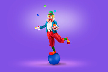 Funny juggler clown juggling balls in the circus, man entertainer as Joker in a suit and wig, with...