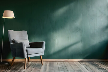 living room with gray armchair on empty dark green wall background
