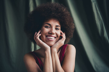 Photo of lovely young lady touch cheeks dreamy dressed red lingerie green studio background no filter self acceptance all body perfect