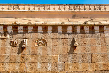 The striped stone wall of the ancient Jain temple on Vindhyagiri hill in Shravanabelagola.