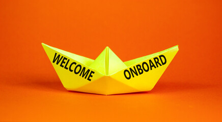 Welcome onboard symbol. Concept words Welcome onboard on beautiful yellow paper boat. Beautiful...