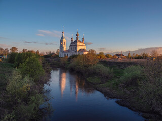 Fototapeta premium Morning landscape, sunrise on the river with monastery.