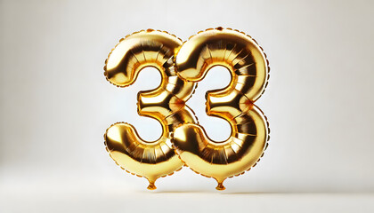 Golden Foil Balloons Forming the Number 33 on a Light Background