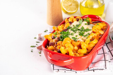 Homemade one pot Chili Mac and Cheese, Chili Macaroni and Cheese Casserole Bake, american mexican tasty gooey dish with beef meat, beans and cheese