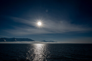Bright Sun Moody Mountains Dark Water 