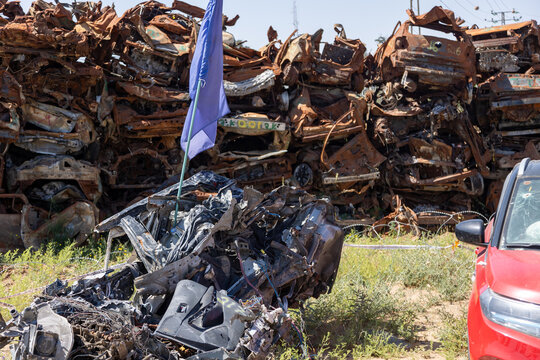 Sa'ad, Israel – May 9 2024, Cars remaining, burned cars after the attack on October 7th by Hamas. The cars were collected on the farmer's field and serves now as an attacks memorial and a remainder.