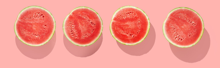 Half of watermelon on pink pastel background