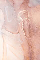 Abstract art featuring swirling pink and gold ink on a white background