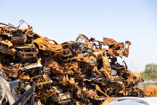 Sa'ad, Israel – May 9 2024, Cars remaining, burned cars after the attack on October 7th by Hamas. The cars were collected on the farmer's field and serves now as an attacks memorial and a remainder.