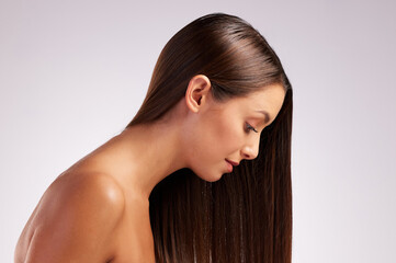 Naklejka premium Woman, straight hair and treatment in studio for cosmetics, healthy glow and white background. Female person, profile and confidence for haircare transformation, grooming and head for dermatology