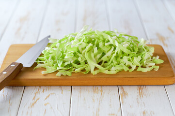 fresh green cabbage on a cutting board, selective focus.