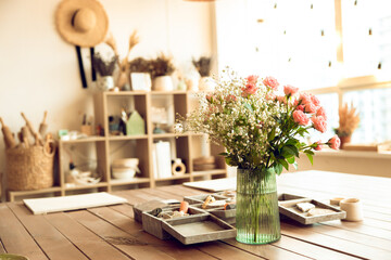 Flowers in a flower pot on the table