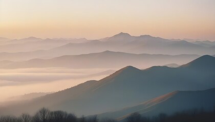 Obraz premium mountain layers and sunrise view in cold and foggy weather.