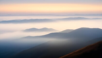 Obraz premium mountain layers and sunrise view in cold and foggy weather.