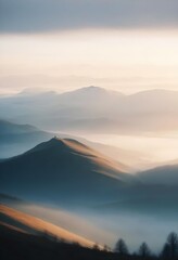 mountain layers and sunrise view in cold and foggy weather.