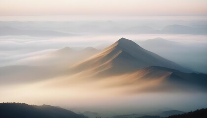 mountain layers and sunrise view in cold and foggy weather.