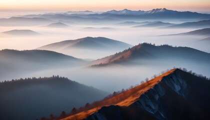 Obraz premium mountain layers and sunrise view in cold and foggy weather.