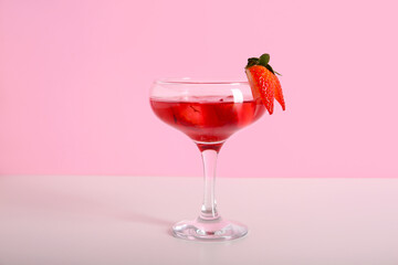 Glass of tasty cocktail with strawberry on colorful background