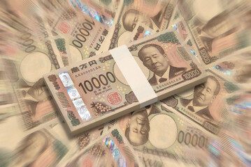 敷き詰められた新紙幣の一万円札と百万円の札束