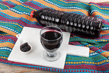 Black Mulberry Syrup. Turkish mulberry confiture pekmez and mulberries on a wooden table. Black...
