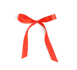 Bow made with red ribbon on white background