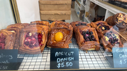 Delicious danish pastry in cabinet in a bakery store