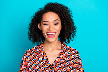 Photo of flirty attractive lady dressed print shirt winking eye empty space isolated turquoise...