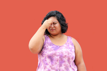 Young 20 year old Latin brunette woman suffers from nasal congestion and pain when she blocks her...