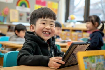 A young child using a tablet with an educational app in a classroom setting, with other students also engaged with technology at their desks.