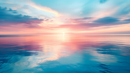 Obraz premium A breathtaking sunrise over a calm, reflective body of water
