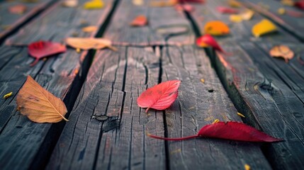 Vintage style background of wooden surface with autumn leaves selective focus